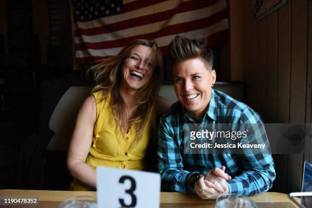 Two women laughing at a diner