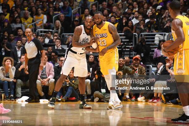 Kawhi Leonard of the LA Clippers and LeBron James of the Los Angeles Lakers fight for position during the game on December 25, 2019 at STAPLES Center...