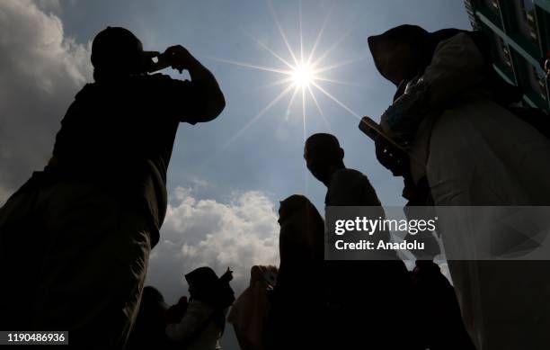 Number of resident witness the phenomenon of the "ring of fire" solar eclipse using a telescope, on December 26, 2019 in Medan, North Sumatra,...