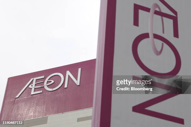 Signage is displayed atop the Aeon Itabashi shopping center, operated by Aeon Retail Co., in Tokyo, Japan, on Thursday, Dec. 26, 2019. About 400 Aeon...