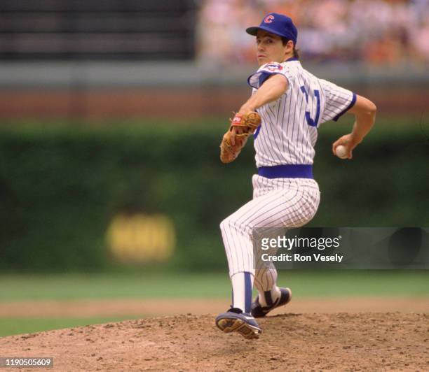 Greg Maddux of the Chicago Cubs pitches during an MLB game at Wrigley Field in Chicago, Illinois during the 1988 season.