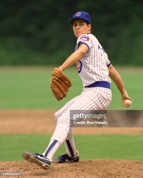 Greg Maddux of the Chicago Cubs pitches during an MLB game at Wrigley Field in Chicago, Illinois during the 1988 season.