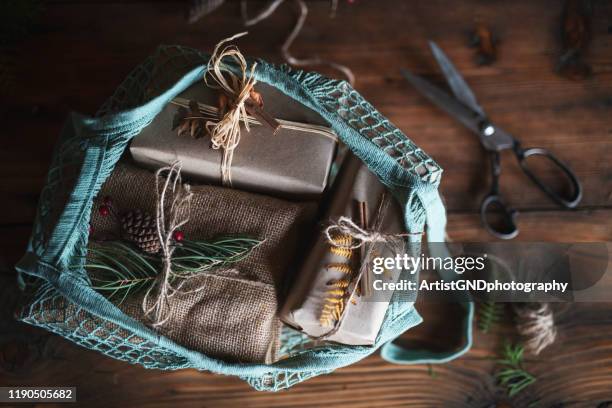 bag with christmas presents. - christmas gift bag stock pictures, royalty-free photos & images