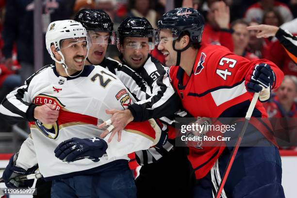 Vincent Trocheck of the Florida Panthers and Tom Wilson of the Washington Capitals are separated in the first period at Capital One Arena on November...