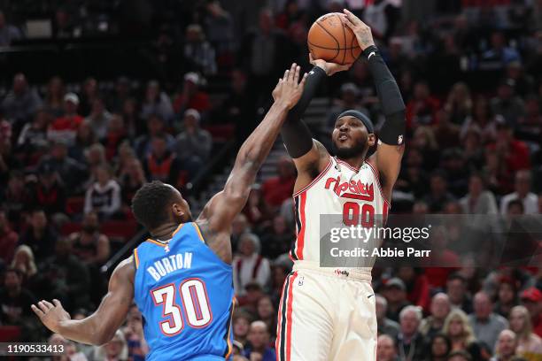 Carmelo Anthony of the Portland Trail Blazers takes a shot against Deonte Burton of the Oklahoma City Thunder in the first quarter during their game...