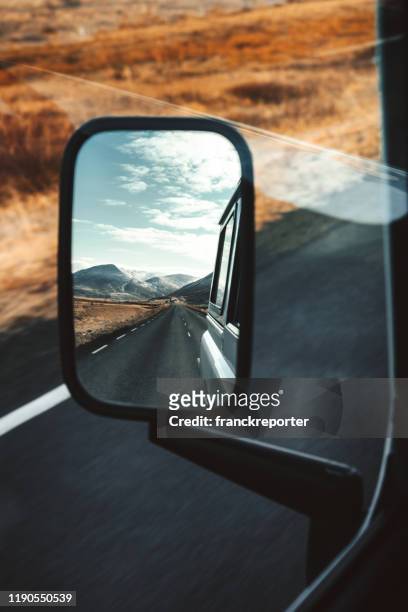 rear mirror of a car running in iceland - vehicle mirror stock pictures, royalty-free photos & images