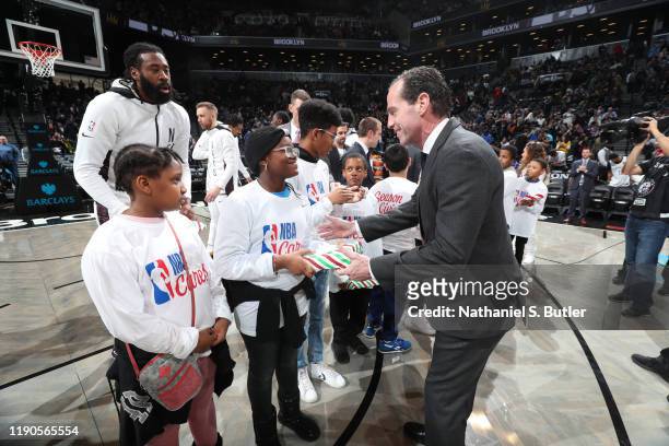 Head Coach Kenny Atkinson of the Brooklyn Nets does a Christmas gift exchange prior to a game against the New York Knicks on December 26, 2019 at...