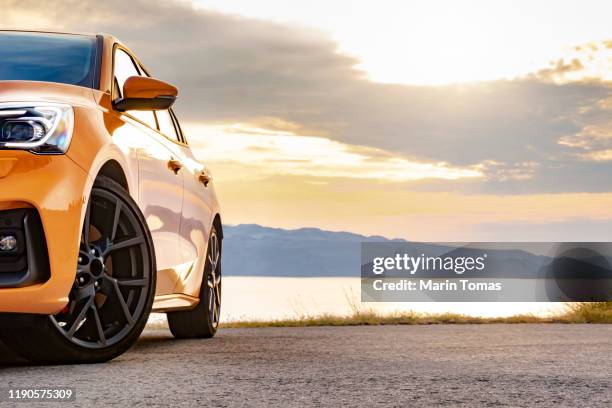 sunset seashore drive - driving sun stockfoto's en -beelden