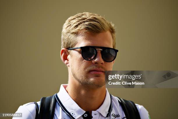 Marcus Ericsson of Sweden and Alfa Romeo Racing walks in the Paddock during previews ahead of the F1 Grand Prix of Abu Dhabi at Yas Marina Circuit on...