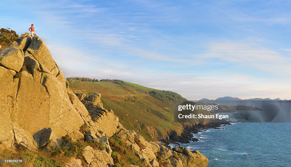 Spain, Galicia, Cangas, woman looking over sea.