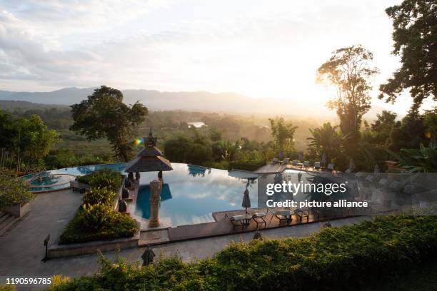 October 2019, Thailand, Wiang: The hotel complex of the Anantara Golden Triangle Elephant Resort at the Golden Triangle at sunrise. Photo: Sebastian...