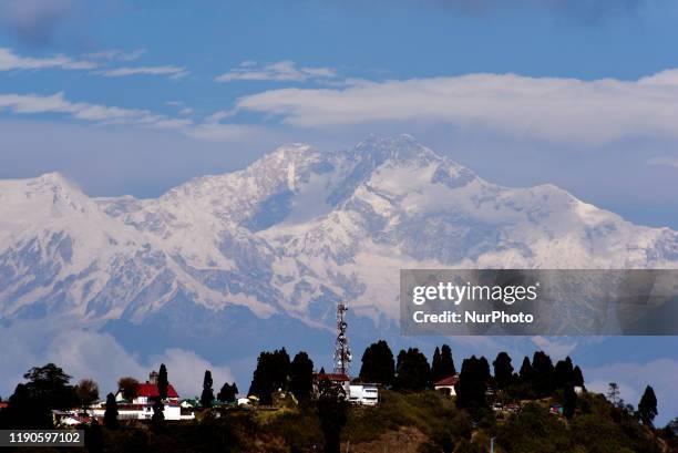 Snow peak Kangchenjunga mountain range can be seen in a hilly place of North Bengal, India, 24 December, 2019.