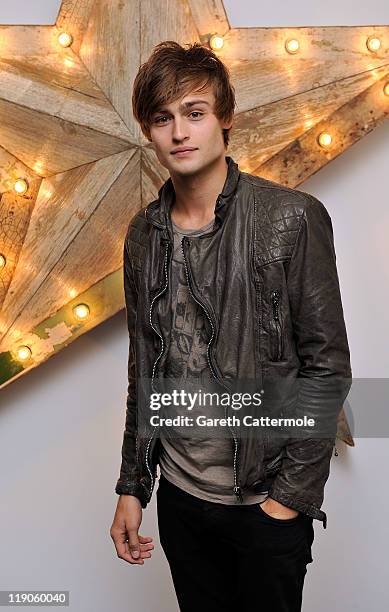 Douglas Booth attends a party for Dolce And Gabbana hosted by Net-a-Porter at Westfield on July 14, 2011 in London, England.