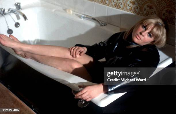 Julie Christie lying in a bath, 1964.