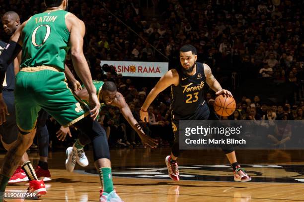 Fred VanVleet of the Toronto Raptors dribbles the ball against the Boston Celtics on December 25, 2019 at the Scotiabank Arena in Toronto, Ontario,...
