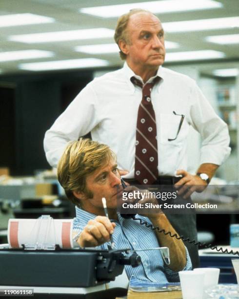 Robert Redford and Jack Warden in a still from the film, 'All the President's Men', USA, circa 1976. The film, adaped from the book by Carl Bernstein...