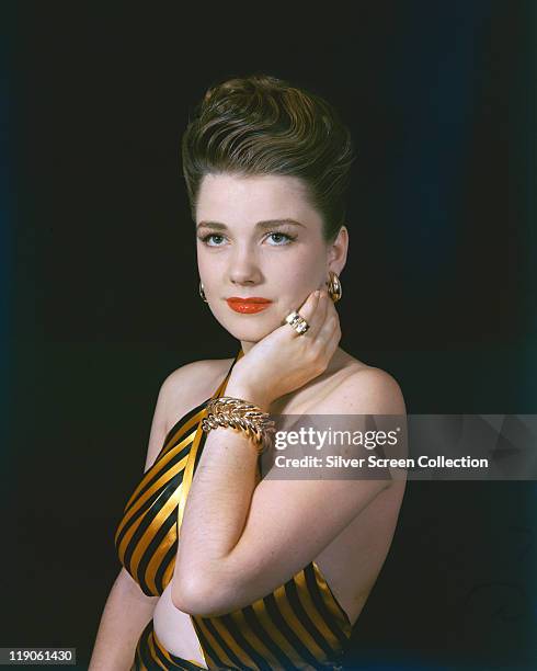 Anne Baxter , US actress, in a glamorous studio portrait, against a dark background, circa 1945.