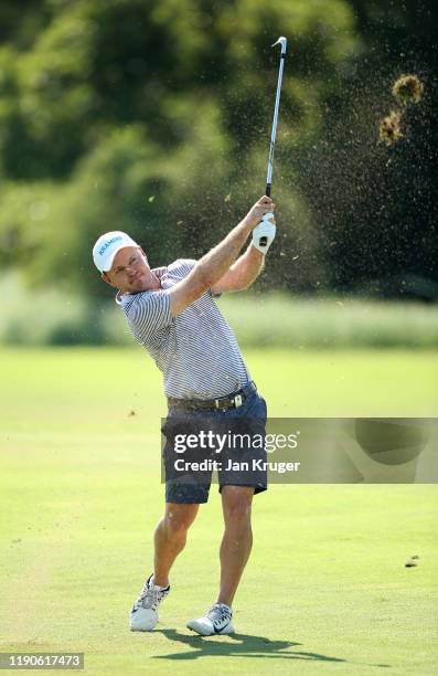 Richard Sterne of South Africa plays his second shot on the 10th hole during Day One of the Alfred Dunhill Championship at Leopard Creek Country Golf...