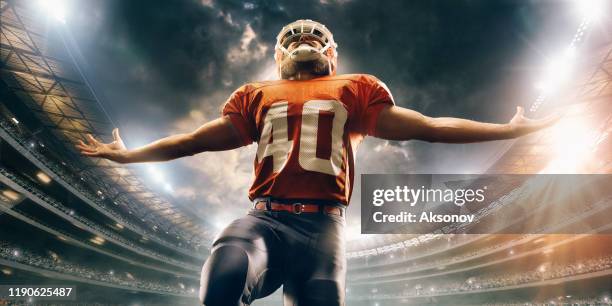 american football player in action - quarterback stock pictures, royalty-free photos & images