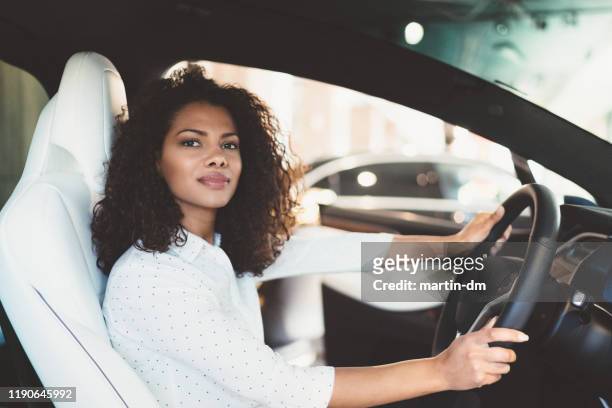 businesswoman buying new car - audi interior stock pictures, royalty-free photos & images