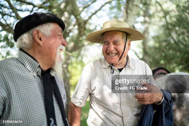 two senior gaucho friends laughing - rio grande do sul state stock pictures, royalty-free photos & images