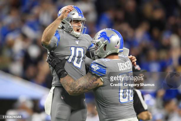 David Blough of the Detroit Lions celebrates his first half touchdown pass with Taylor Decker of the Detroit Lions while playing the Chicago Bears at...