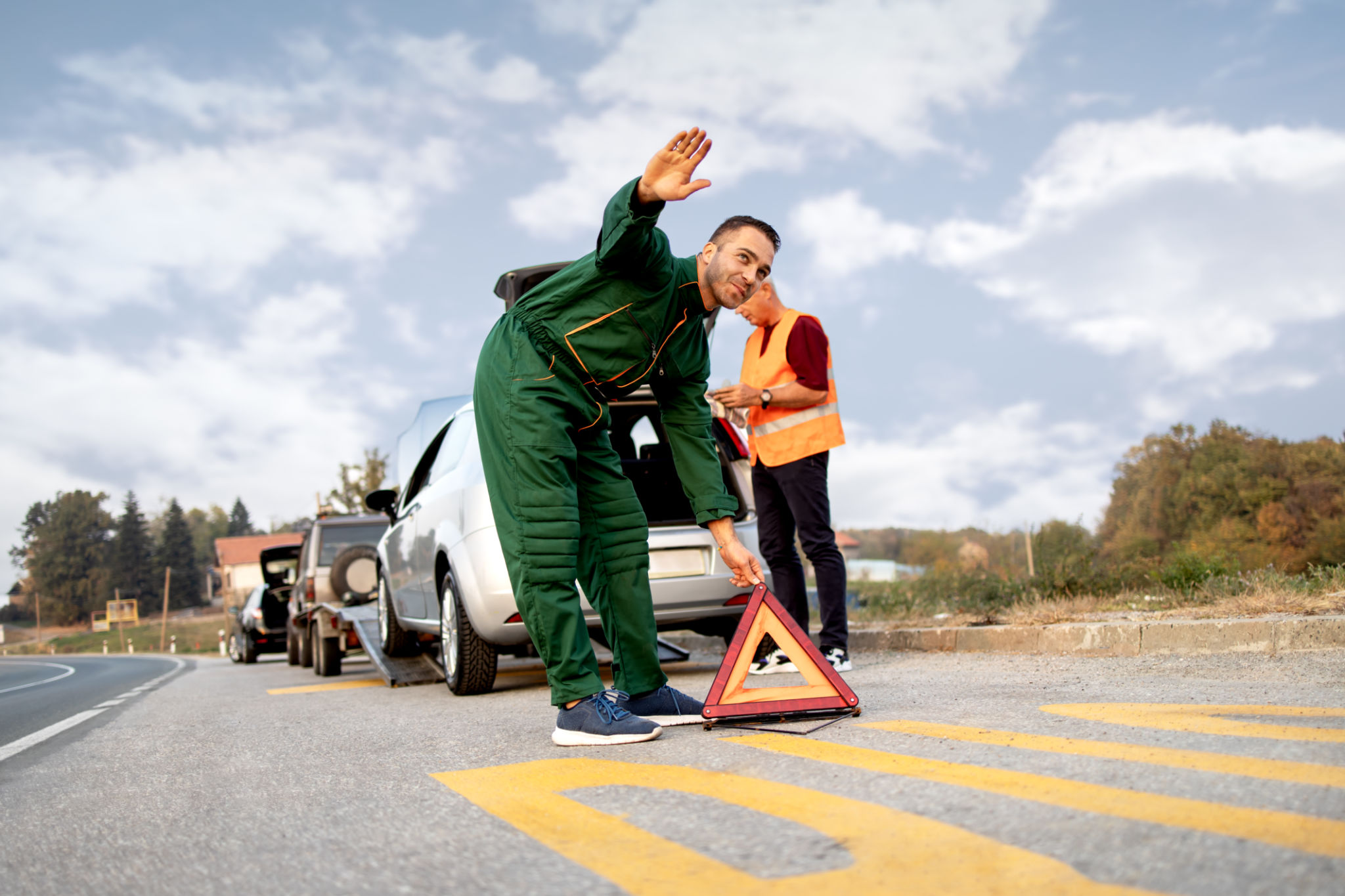 mechanic helping driver