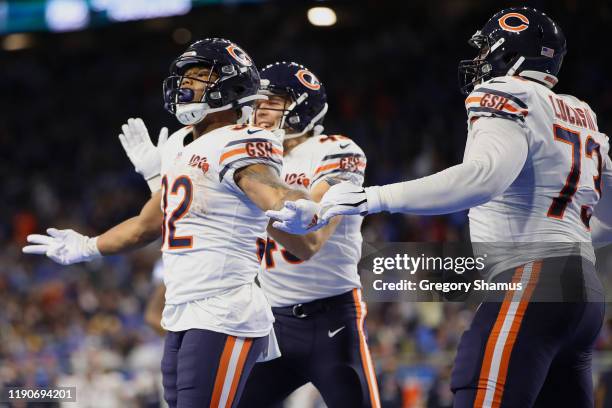 David Montgomery of the Chicago Bears celebrates his fourth quarter touchdown with teammates while playing the Detroit Lions at Ford Field on...