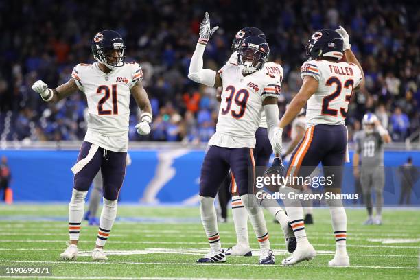 Eddie Jackson of the Chicago Bears celebrates his fourth quarter interception with Ha Ha Clinton-Dix and Kyle Fuller to seal a 24-20 win over the...