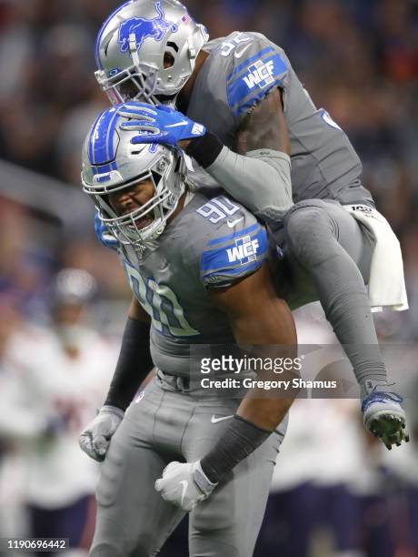Trey Flowers of the Detroit Lions celebrates a second half sack with Tavon Wilson while playing the Chicago Bears at Ford Field on November 28, 2019...