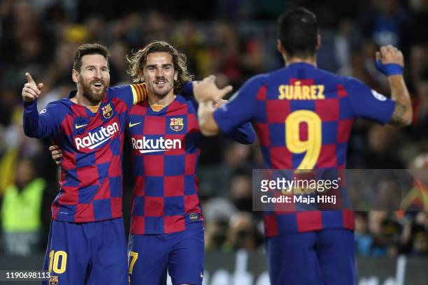 Lionel Messi of Barcelona celebrates with Luis Suarez of Barcelona and Antoine Griezmann of FC Barcelona after scoring his team's second goal during...