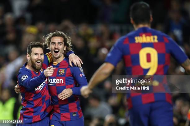 Lionel Messi of Barcelona celebrates with Luis Suarez of Barcelona and Antoine Griezmann of FC Barcelona after scoring his team's second goal during...