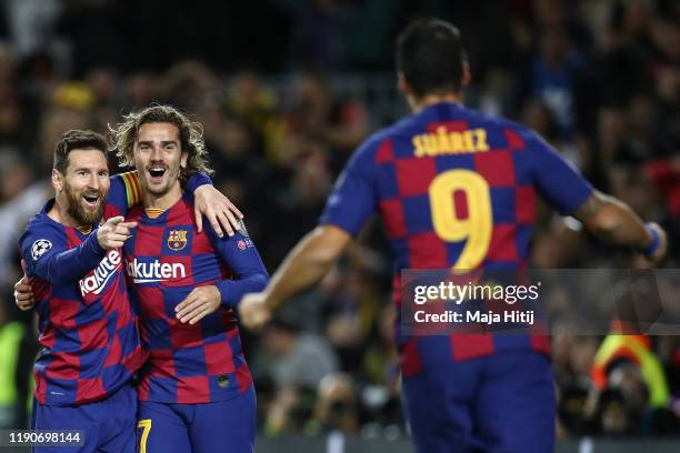 Lionel Messi of Barcelona celebrates with Luis Suarez of Barcelona and Antoine Griezmann of FC Barcelona after scoring his team's second goal during...