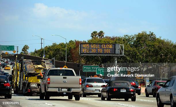 Traffic signs alerts motorists on Interstate 405 of the shutdown one day before workers start demolishing the Mulholland Bridge on Interstate 405 at...
