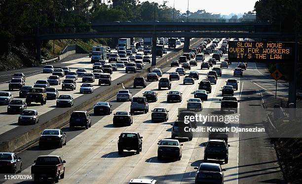 Traffic flows slowly on Interstate 10 during rush hour two days before the 11-mile shutdown of Interstate 405 for the demolition of Mulholland Bridge...
