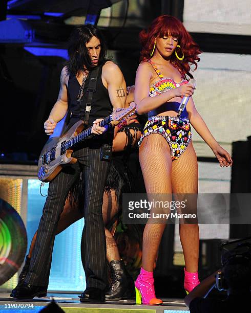 Nuno Bettencourt and Rihanna perform at BankAtlantic Center on July 14, 2011 in Sunrise, Florida.