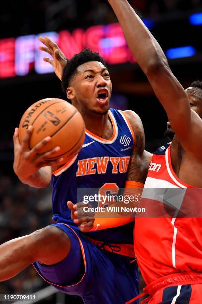 Elfrid Payton of the New York Knicks shoots in front of Ian Mahinmi of the Washington Wizards during the first half at Capital One Arena on December...