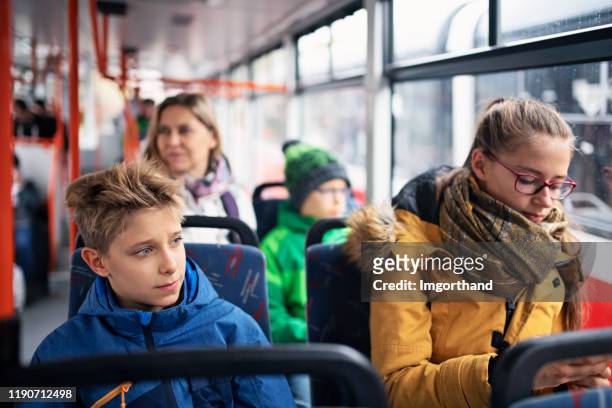 kids going to school by public transport - crowded public transport stock pictures, royalty-free photos & images