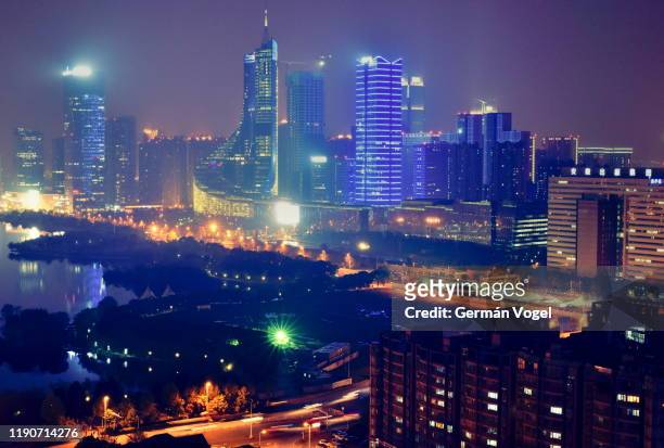 modern chinese city skyline at night, hefei, china - anhui province stock pictures, royalty-free photos & images