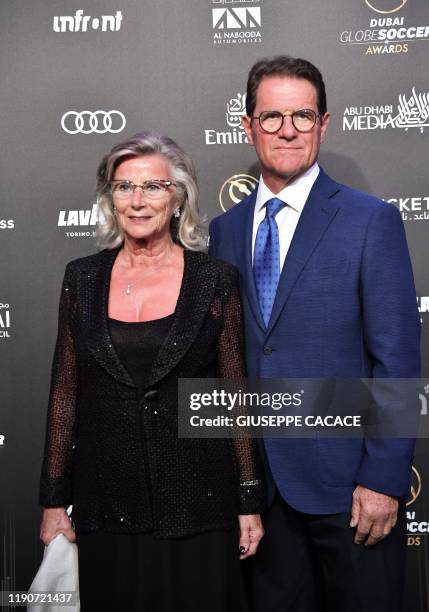 Former Italian player and team manager Fabio Capello arrives with his wife Laura Ghisi to attend the 11th edition of the Globe Soccer Awards ceremony...