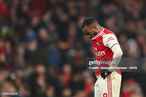 Alexandre Lacazette of Arsenal dejected at full time of the Premier League match between Arsenal FC and Chelsea FC at Emirates Stadium on December...