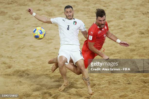 Marcello Percia Montani of Italy is challenged by Philipp Borer of Switzerland during the FIFA Beach Soccer World Cup Paraguay 2019 quarterfinal...