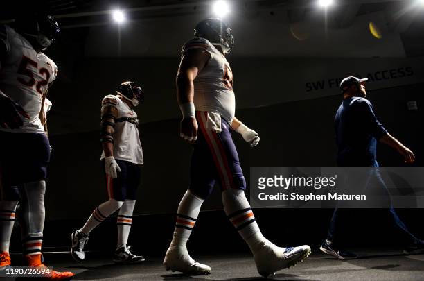Members of the Chicago Bears walk out of the tunnel during pregame warmups before playing the Minnesota Vikings at U.S. Bank Stadium on December 29,...