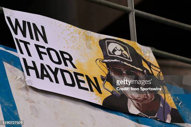 Sign for former Iowa coach Hayden Fry, who recently passed away, during the San Diego County Credit Union Holiday Bowl football game between the USC...