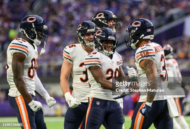 David Montgomery of the Chicago Bears celebrates with teammates after scoring a touchdown in the third quarter of the game against the Minnesota...
