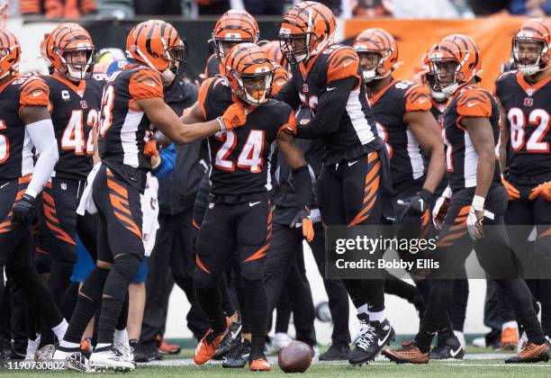 Darius Phillips of the Cincinnati Bengals and the Cincinnati Bengals defense celebrate after Phillips made an interception in the third quarter of...