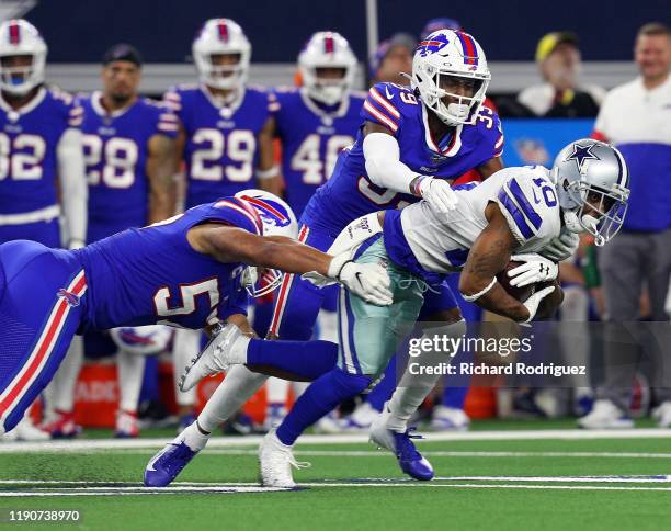 Tavon Austin of the Dallas Cowboys is tackled by Levi Wallace and Lorenzo Alexander of the Buffalo Bills in the fourth quarter at AT&T Stadium on...