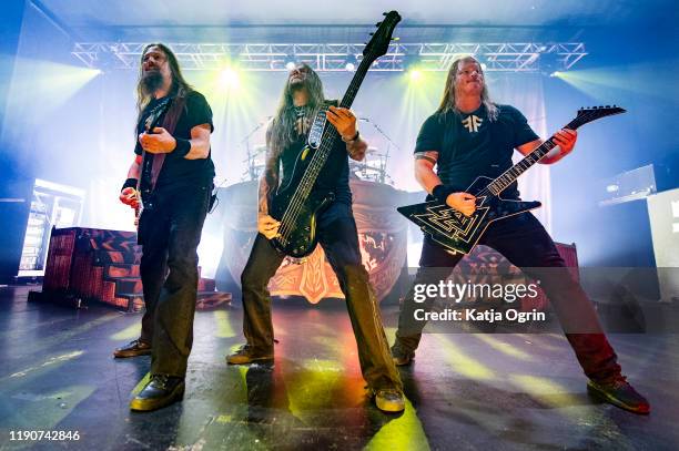 Johan Söderberg, Ted Lundström and Olavi Mikkonen of Amon Amarth perform at O2 Academy Birmingham on November 28, 2019 in Birmingham, England. (Photo...