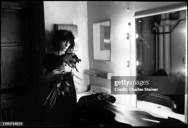 Patti Smith poses backstage before performing at the event "Arista Records Salutes New York with a Festival of Great Music” at City Center. September...
