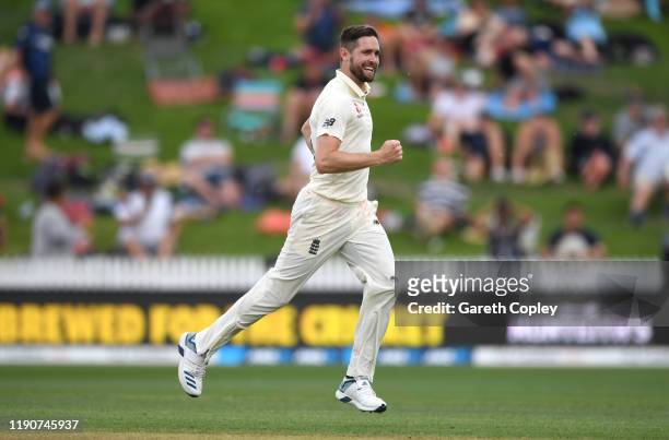 Chris Woakes of England celebrates dismissing Ross Taylor of New Zealand during day 1 of the second Test match between New Zealand and England at...